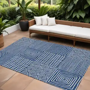 Photo of Navy Blue And Ivory Geometric Washable Indoor Outdoor Area Rug