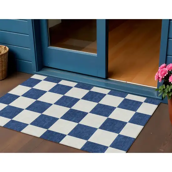 Navy Blue And Ivory Geometric Washable Indoor Outdoor Area Rug Photo 1