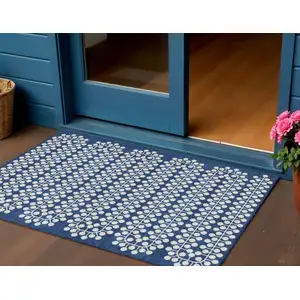 Photo of Navy Blue And Ivory Geometric Washable Indoor Outdoor Area Rug