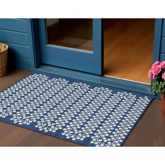 Navy Blue And Ivory Geometric Washable Indoor Outdoor Area Rug Photo 1