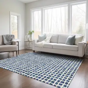 Photo of Navy Blue And Ivory Geometric Washable Indoor Outdoor Area Rug