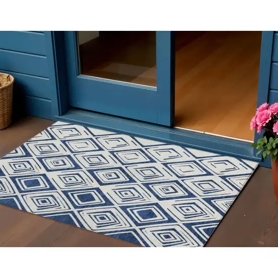 Navy Blue And Ivory Geometric Washable Indoor Outdoor Area Rug Photo 1