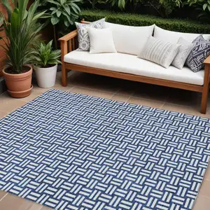 Photo of Navy Blue And Ivory Geometric Washable Indoor Outdoor Area Rug
