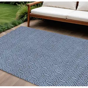 Photo of Navy Blue And Ivory Geometric Washable Indoor Outdoor Area Rug