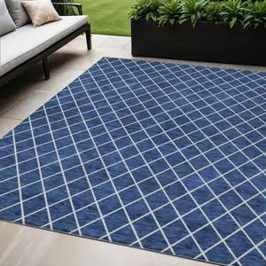 Photo of Navy Blue And Ivory Geometric Washable Indoor Outdoor Area Rug