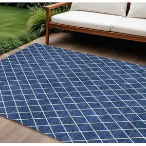 Photo of Navy Blue And Ivory Geometric Washable Indoor Outdoor Area Rug