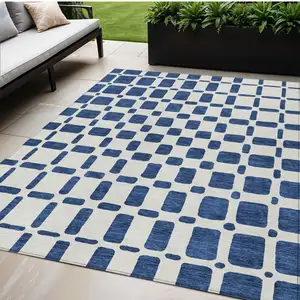 Photo of Navy Blue And Ivory Geometric Washable Indoor Outdoor Area Rug