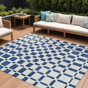 Photo of Navy Blue And Ivory Geometric Washable Indoor Outdoor Area Rug