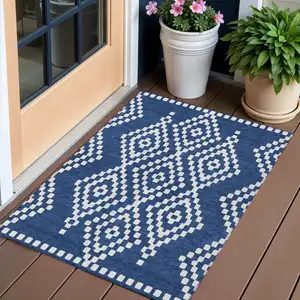 Photo of Navy Blue And Ivory Geometric Washable Indoor Outdoor Area Rug