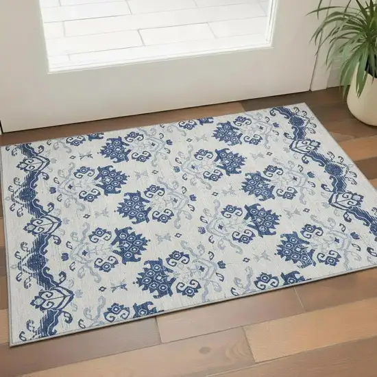 Navy Blue And Ivory Medallion Washable Area Rug With UV Protection Photo 1