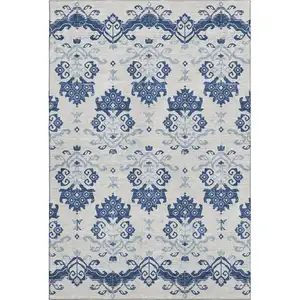 Photo of Navy Blue And Ivory Medallion Washable Area Rug With UV Protection