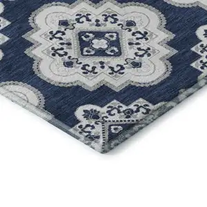 Photo of Navy Blue And Ivory Medallion Washable Area Rug With UV Protection