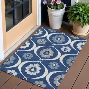 Photo of Navy Blue And Ivory Medallion Washable Indoor Outdoor Area Rug