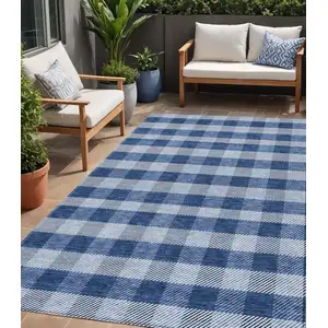 Photo of Navy Blue And Ivory Plaid Washable Indoor Outdoor Area Rug