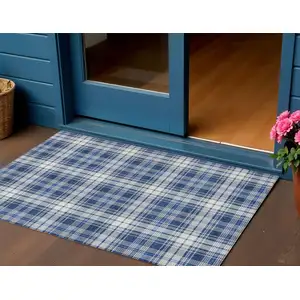 Photo of Navy Blue And Ivory Plaid Washable Indoor Outdoor Area Rug