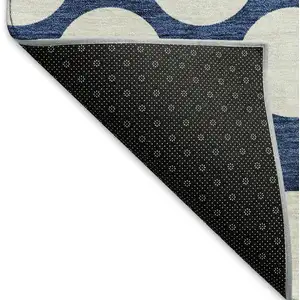 Photo of Navy Blue And Ivory Polka Dot Washable Area Rug With UV Protection
