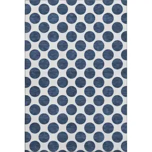 Photo of Navy Blue And Ivory Polka Dot Washable Area Rug With UV Protection