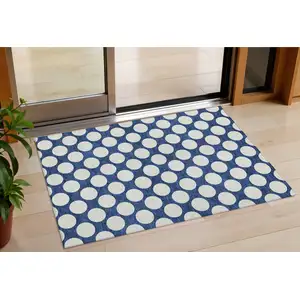 Photo of Navy Blue And Ivory Polka Dot Washable Indoor Outdoor Area Rug