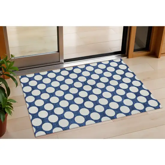 Navy Blue And Ivory Polka Dot Washable Indoor Outdoor Area Rug Photo 1