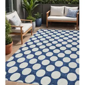 Photo of Navy Blue And Ivory Polka Dot Washable Indoor Outdoor Area Rug
