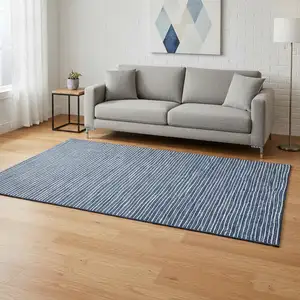 Photo of Navy Blue And Ivory Striped Washable Area Rug With UV Protection