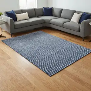 Photo of Navy Blue And Ivory Striped Washable Area Rug With UV Protection