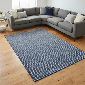 Photo of Navy Blue And Ivory Striped Washable Area Rug With UV Protection