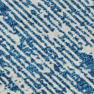 Photo of Navy Blue And Ivory Striped Washable Area Rug With UV Protection