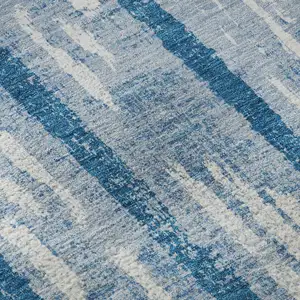 Photo of Navy Blue And Ivory Striped Washable Area Rug With UV Protection