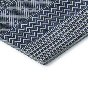 Photo of Navy Blue And Ivory Striped Washable Area Rug With UV Protection