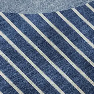 Photo of Navy Blue And Ivory Striped Washable Area Rug With UV Protection