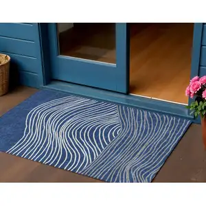 Photo of Navy Blue And Ivory Striped Washable Indoor Outdoor Area Rug