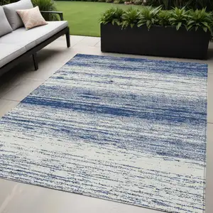 Photo of Navy Blue And Ivory Striped Washable Indoor Outdoor Area Rug