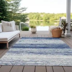 Photo of Navy Blue And Ivory Striped Washable Indoor Outdoor Area Rug