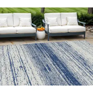 Photo of Navy Blue And Ivory Striped Washable Indoor Outdoor Area Rug
