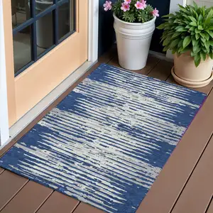 Photo of Navy Blue And Ivory Striped Washable Indoor Outdoor Area Rug