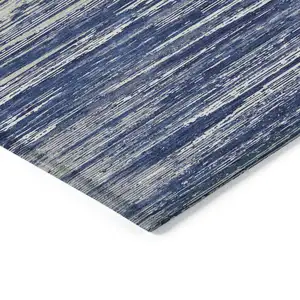 Photo of Navy Blue And Ivory Striped Washable Indoor Outdoor Area Rug
