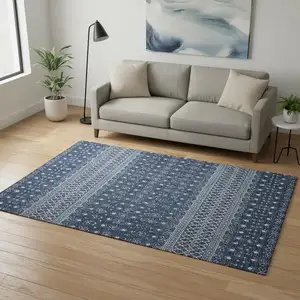 Photo of Navy Blue And Ivory Tribal Washable Area Rug With UV Protection