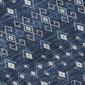 Photo of Navy Blue And Ivory Tribal Washable Area Rug With UV Protection