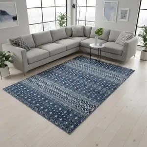 Photo of Navy Blue And Ivory Tribal Washable Area Rug With UV Protection