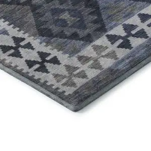 Photo of Navy Blue And Ivory Tribal Washable Area Rug With UV Protection