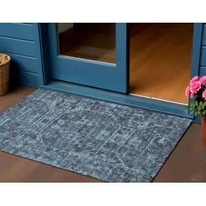 Photo of Navy Blue And Ivory Tribal Washable Indoor Outdoor Area Rug