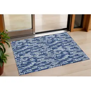 Photo of Navy Blue And Ivory Tribal Washable Indoor Outdoor Area Rug