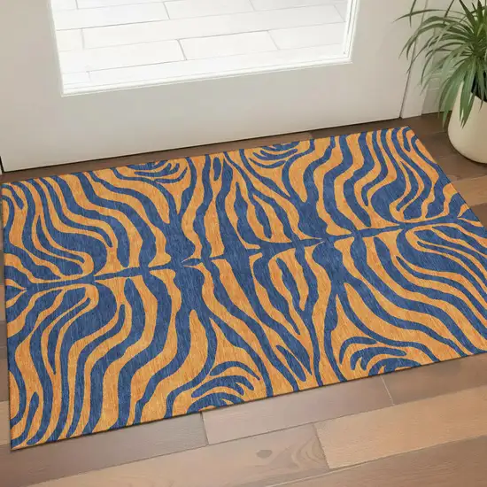 Navy Blue And Orange Animal Print Washable Area Rug With UV Protection Photo 1