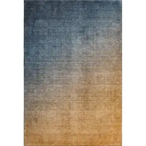 Photo of Navy Blue And Orange Ombre Washable Area Rug With UV Protection