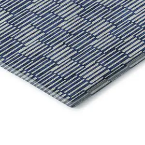 Photo of Navy Blue And Silver Abstract Geometric Washable Area Rug With UV Protection