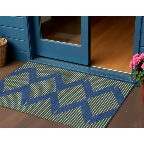 Navy Blue And Yellow Geometric Washable Indoor Outdoor Area Rug Photo 1