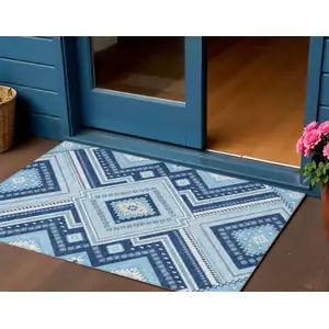 Photo of Navy Blue Aqua And Ivory Tribal Washable Indoor Outdoor Area Rug