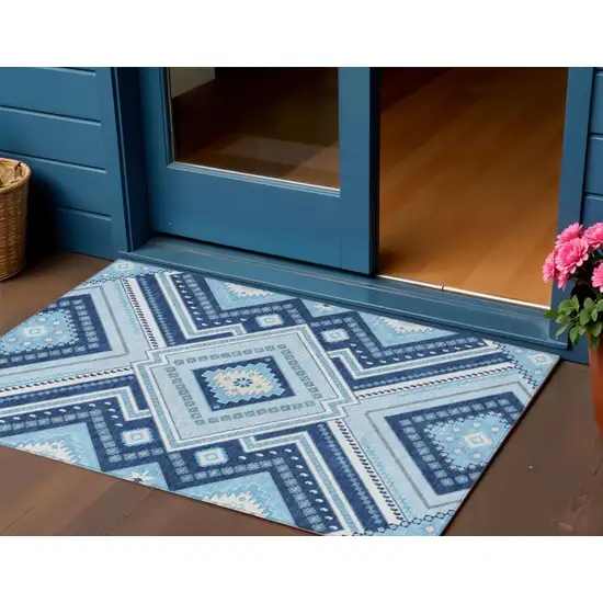 Navy Blue Aqua And Ivory Tribal Washable Indoor Outdoor Area Rug Photo 1