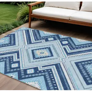 Photo of Navy Blue Aqua And Ivory Tribal Washable Indoor Outdoor Area Rug